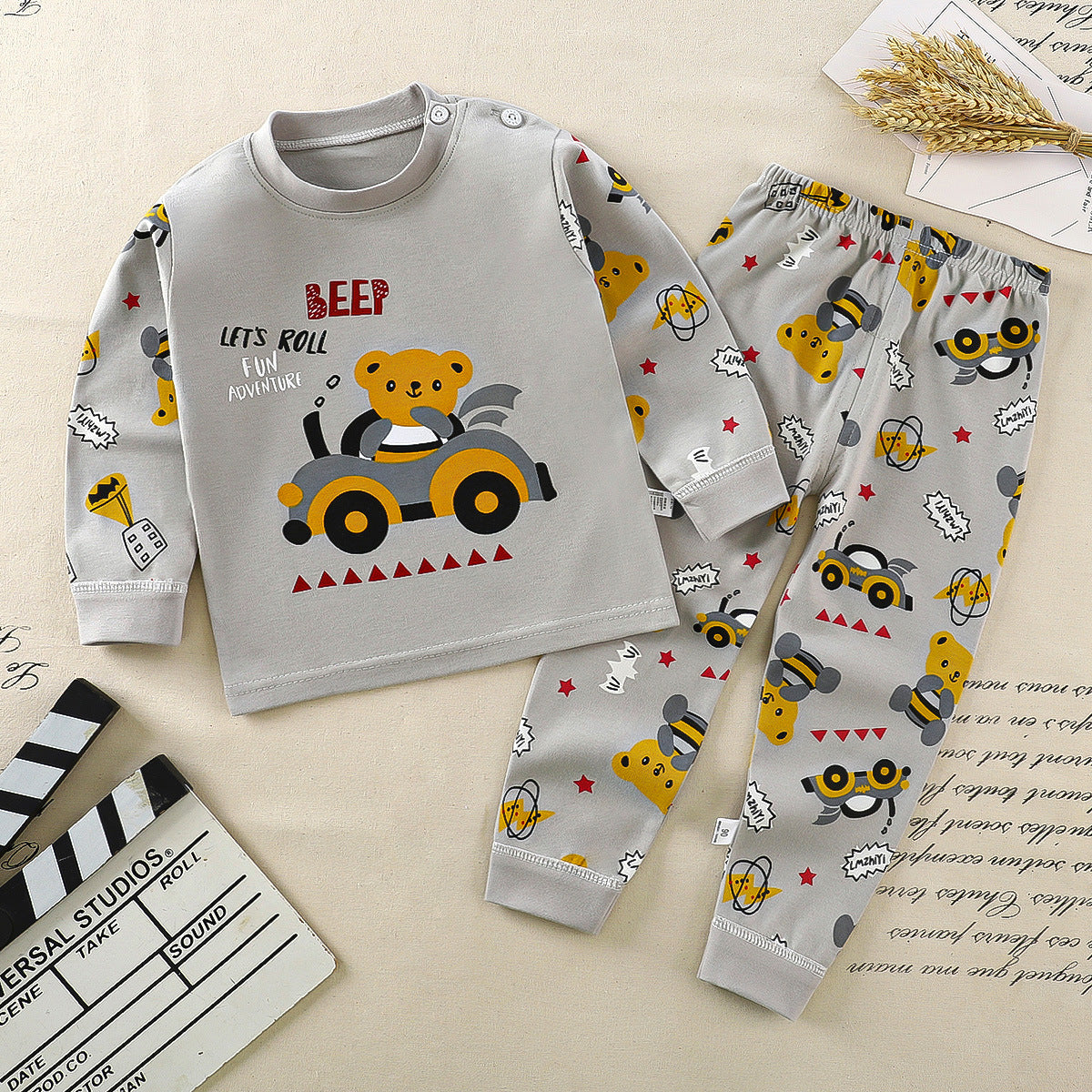 Black and white striped long-sleeve shirt with a small embroidered logo on the chest