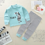 Black and white striped long-sleeve shirt with a small embroidered logo on the chest