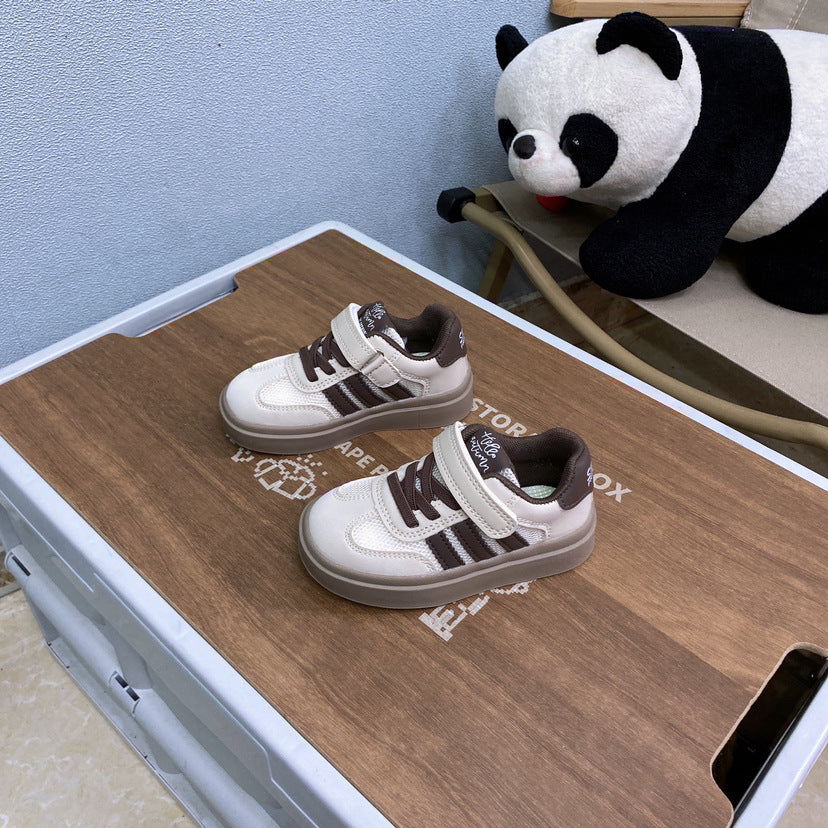 Image of a black and white sneaker with a thick sole and a modern design