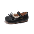 Image of a black and white striped long-sleeve shirt with a small embroidered logo on the chest