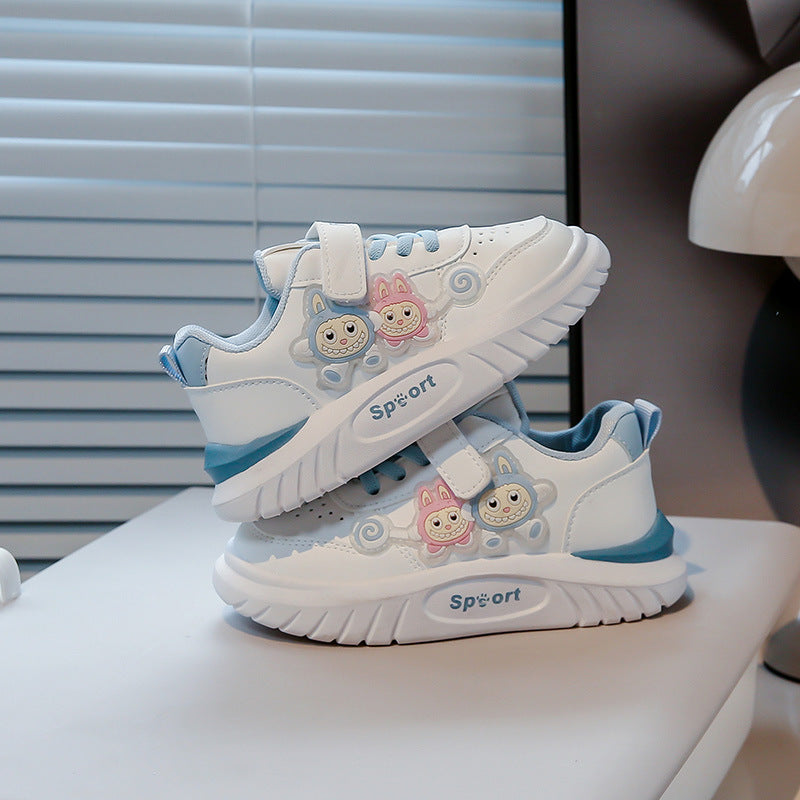 Image showing a pair of black and white sneakers with a thick sole and a modern design.