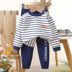 Black and white striped long-sleeve shirt with a small embroidered logo on the chest