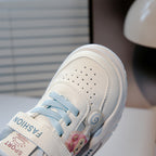 Image showing a close-up of a black and white sneaker with a thick sole and a mesh upper.