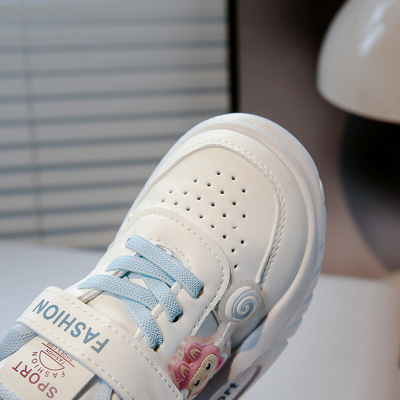Image showing a close-up of a black and white sneaker with a thick sole and a mesh upper.